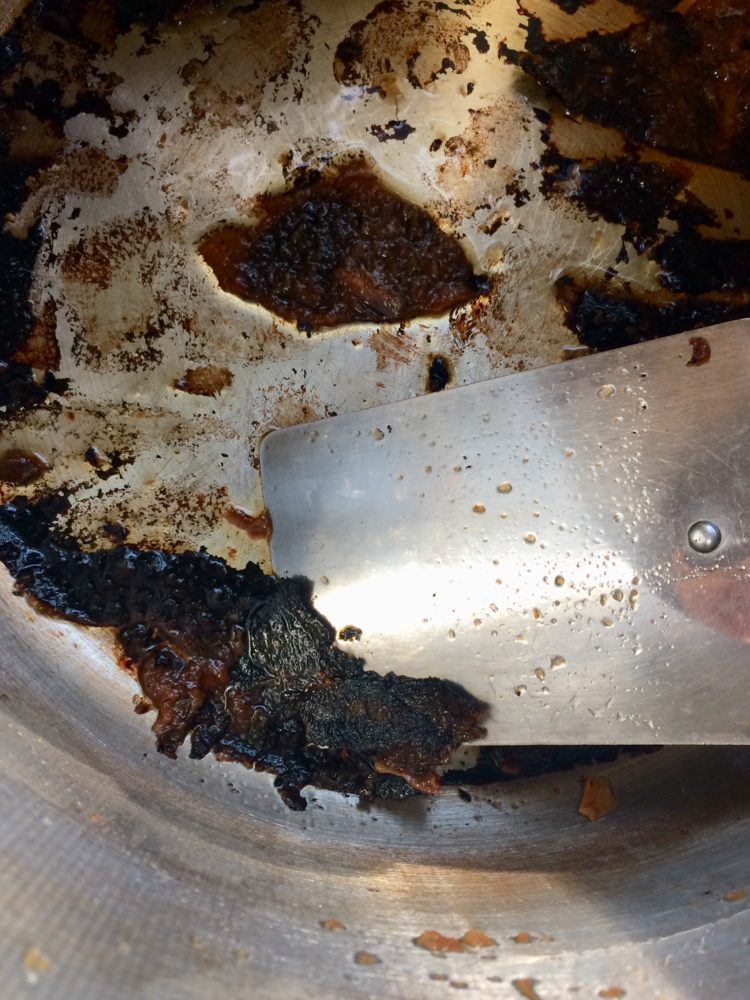 Cleaning burnt-on mess in a pot